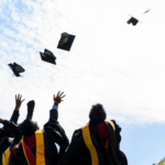 grads throwing caps in the air
